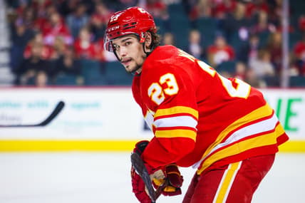 Mar 12, 2022; Calgary, Alberta, CAN; Calgary Flames center Sean Monahan (23) during the face off against the Detroit Red Wings during the second period at Scotiabank Saddledome. Mandatory Credit: Sergei Belski-USA TODAY Sports