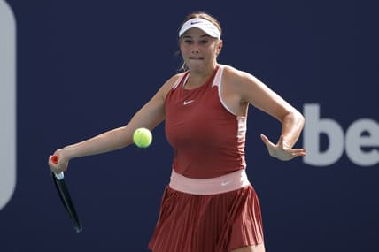 Mar 22, 2022; Miami Gardens, FL, USA; Amanda Anisimova of the United States hits a forehand against Shelby Rogers of the United States (not pictured) in a first round women's singles match in the Miami Open at Hard Rock Stadium. Mandatory Credit: Geoff Burke-USA TODAY Sports
