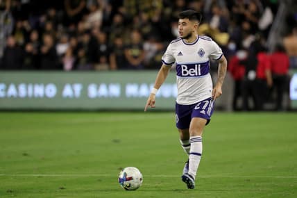 Mar 20, 2022; Los Angeles, California, USA; Vancouver Whitecaps FC midfielder Ryan Raposo (27) dribbles the ball during the second half against the Los Angeles FC at Banc of California Stadium. LAFC won 3-1. Mandatory Credit: Kiyoshi Mio-USA TODAY Sports