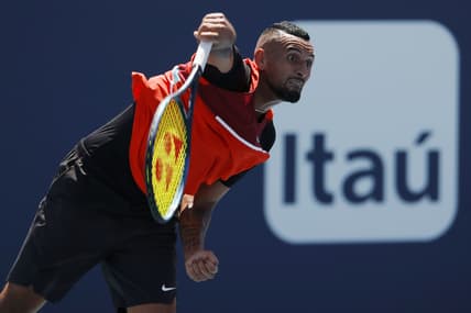 Mar 29, 2022; Miami Gardens, FL, USA; Nick Kyrgios (AUS) serves against Jannik Sinner (ITA)(not pictured) in a fourth round men's singles match in the Miami Open at Hard Rock Stadium. Mandatory Credit: Geoff Burke-USA TODAY Sports