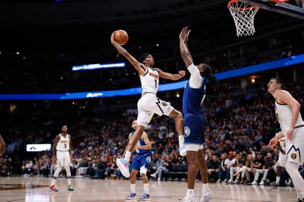 Apr 1, 2022; Denver, Colorado, USA; Denver Nuggets guard Bones Hyland (3) drives to the net against Minnesota Timberwolves center Naz Reid (11) in the first quarter at Ball Arena. Mandatory Credit: Isaiah J. Downing-USA TODAY Sports