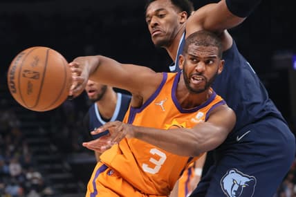 Apr 1, 2022; Memphis, Tennessee, USA; Phoenix Suns guard Chris Paul (3) passes the ball as Memphis Grizzlies center Xavier Tillman (2) defends at FedExForum. Mandatory Credit: Joe Rondone-USA TODAY Sports