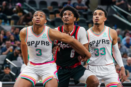 Apr 1, 2022; San Antonio, Texas, USA; San Antonio Spurs forward Keldon Johnson (3) blocks out Portland Trail Blazers guard Keon Johnson (6) in the second half at the AT&T Center. Mandatory Credit: Daniel Dunn-USA TODAY Sports