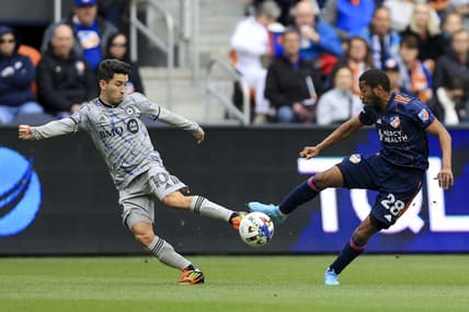 Apr 2, 2022; Cincinnati, Ohio, USA;  CF Montreal midfielder Joaquin Torres (10) plays the ball against FC Cincinnati defender Ray Gaddis (28) in the first half at TQL Stadium. Mandatory Credit: Aaron Doster-USA TODAY Sports