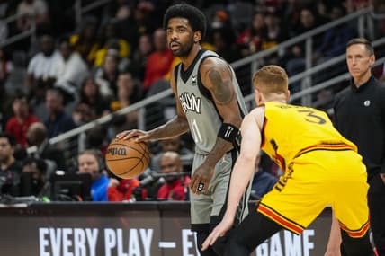 Apr 2, 2022; Atlanta, Georgia, USA; Brooklyn Nets guard Kyrie Irving (11) dribbles guarded by Atlanta Hawks guard Kevin Huerter (3) during the first half at State Farm Arena. Mandatory Credit: Dale Zanine-USA TODAY Sports