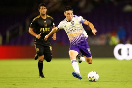 Apr 2, 2022; Orlando, Florida, USA;  Orlando City midfielder Mauricio Pereyra (10) looks to shoot the ball against Los Angeles FC in the first half at Orlando City Stadium. Mandatory Credit: Nathan Ray Seebeck-USA TODAY Sports