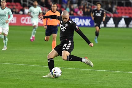 Apr 2, 2022; Washington, District of Columbia, USA;  D.C. United defender Brad Smith (5) takes a shot in the first half against the Atlanta United at Audi Field. Mandatory Credit: Mitchell Layton-USA TODAY Sports