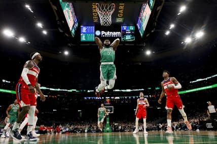 Apr 3, 2022; Boston, Massachusetts, USA; Boston Celtics guard Jaylen Brown (7) goes in for a dunk as Washington Wizards guard Kentavious Caldwell-Pope (1) and forward Rui Hachimura (8) look on during the first half at TD Garden. Mandatory Credit: Winslow Townson-USA TODAY Sports