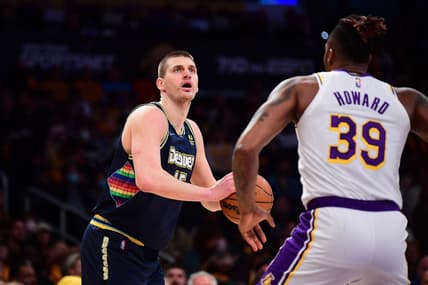 Apr 3, 2022; Los Angeles, California, USA; Denver Nuggets center Nikola Jokic (15) controls the ball against Los Angeles Lakers center Dwight Howard (39) during the first half at Crypto.com Arena. Mandatory Credit: Gary A. Vasquez-USA TODAY Sports