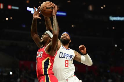 Apr 3, 2022; Los Angeles, California, USA; Los Angeles Clippers forward Marcus Morris Sr. (8) blocks the shot of New Orleans Pelicans forward Naji Marshall (8) during the first half at Crypto.com Arena. Mandatory Credit: Gary A. Vasquez-USA TODAY Sports