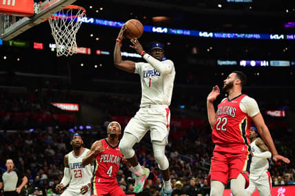 Apr 3, 2022; Los Angeles, California, USA; Los Angeles Clippers guard Reggie Jackson (1) passes the ball against New Orleans Pelicans forward Larry Nance Jr. (22) during the second half at Crypto.com Arena. Mandatory Credit: Gary A. Vasquez-USA TODAY Sports