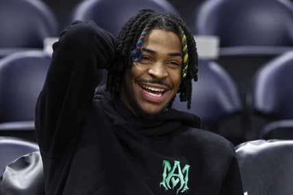 Apr 5, 2022; Salt Lake City, Utah, USA;  Memphis Grizzlies guard Ja Morant (12) watches his teammates warm up prior to their game against the Utah Jazz at Vivint Arena. Mandatory Credit: Jeffrey Swinger-USA TODAY Sports