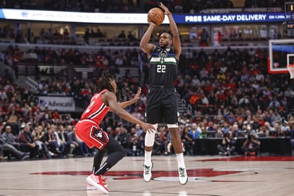 Apr 5, 2022; Chicago, Illinois, USA; Milwaukee Bucks forward Khris Middleton (22) shoots against Chicago Bulls guard Ayo Dosunmu (12) during the first half at United Center. Mandatory Credit: Kamil Krzaczynski-USA TODAY Sports