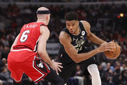 Apr 5, 2022; Chicago, Illinois, USA; Milwaukee Bucks forward Giannis Antetokounmpo (34) drives to the basket against Chicago Bulls guard Alex Caruso (6) during the first half at United Center. Mandatory Credit: Kamil Krzaczynski-USA TODAY Sports