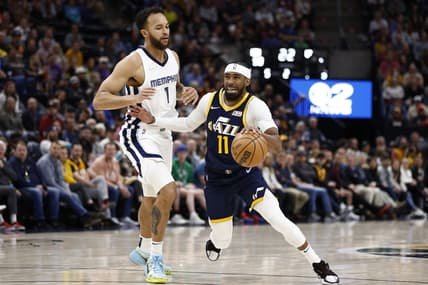 Apr 5, 2022; Salt Lake City, Utah, USA; Utah Jazz guard Mike Conley (11) and Memphis Grizzlies forward Kyle Anderson (1) battle in the second quarter at Vivint Arena. Mandatory Credit: Jeffrey Swinger-USA TODAY Sports
