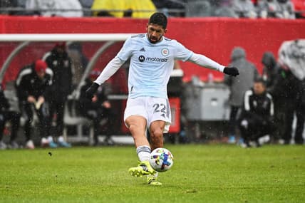 Apr 2, 2022; Chicago, Illinois, USA;  Chicago Fire FC defender Mauricio Pineda (22) controls the ball against FC Dallas at Soldier Field. Mandatory Credit: Jamie Sabau-USA TODAY Sports