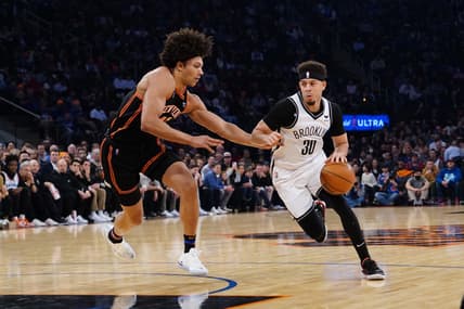 Apr 6, 2022; New York, New York, USA; Brooklyn Nets shooting guard Seth Curry (30)m dribbles the ball against New York Knicks power forward Jericho Sims (45)  during the first half at Madison Square Garden. Mandatory Credit: Gregory Fisher-USA TODAY Sports