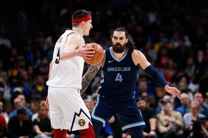 Apr 7, 2022; Denver, Colorado, USA; Denver Nuggets center Nikola Jokic (15) controls the ball as Memphis Grizzlies center Steven Adams (4) guards in the second quarter at Ball Arena. Mandatory Credit: Isaiah J. Downing-USA TODAY Sports