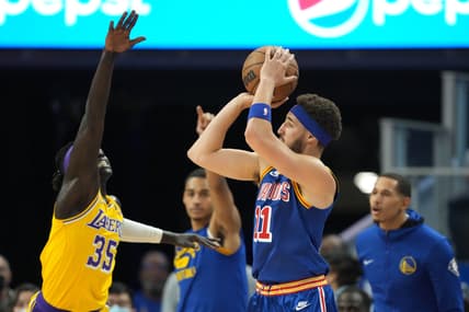 Apr 7, 2022; San Francisco, California, USA; Golden State Warriors guard Klay Thompson (11) shoots against Los Angeles Lakers forward Wenyen Gabriel (35) during the second quarter at Chase Center. Mandatory Credit: Darren Yamashita-USA TODAY Sports