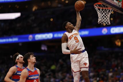 Apr 8, 2022; Washington, District of Columbia, USA; New York Knicks guard RJ Barrett (9) dunks the ball as Washington Wizards forward Deni Avdija (9) looks on in the second quarter at Capital One Arena. Mandatory Credit: Geoff Burke-USA TODAY Sports