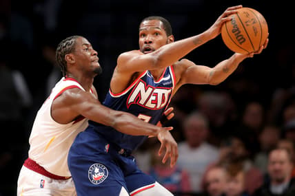 Apr 8, 2022; Brooklyn, New York, USA; Brooklyn Nets forward Kevin Durant (7) controls the ball against Cleveland Cavaliers guard Caris LeVert (3) during the first quarter at Barclays Center. Mandatory Credit: Brad Penner-USA TODAY Sports