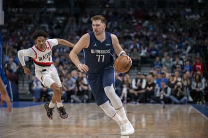 Apr 8, 2022; Dallas, Texas, USA; Dallas Mavericks guard Luka Doncic (77) brings the ball up court against the Portland Trail Blazers during the first quarter at the American Airlines Center. Mandatory Credit: Jerome Miron-USA TODAY Sports