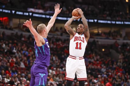 Apr 8, 2022; Chicago, Illinois, USA; Chicago Bulls forward DeMar DeRozan (11) shoots against Charlotte Hornets center Mason Plumlee (24) during the first half at United Center. Mandatory Credit: Kamil Krzaczynski-USA TODAY Sports