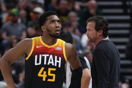 Apr 8, 2022; Salt Lake City, Utah, USA; Utah Jazz guard Donovan Mitchell (45) speaks with head coach Quin Snyder during a fourth quarter break in action against the Phoenix Suns at Vivint Arena. Mandatory Credit: Rob Gray-USA TODAY Sports