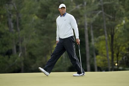Apr 9, 2022; Augusta, Georgia, USA; Tiger Woods watches his putt on no. 18 during the third round of The Masters golf tournament at Augusta National Golf Club. Mandatory Credit: Adam Cairns-Augusta Chronicle/USA TODAY Sports