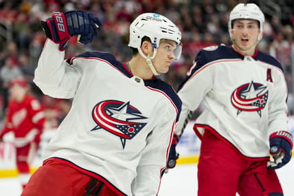 Apr 9, 2022; Detroit, Michigan, USA; Columbus Blue Jackets center Jack Roslovic (96) celebrates after scoring a goal during the first period against the Detroit Red Wings at Little Caesars Arena. Mandatory Credit: Raj Mehta-USA TODAY Sports