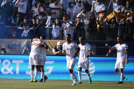 Apr 9, 2022; Carson, California, USA; Los Angeles Galaxy defender S ga Coulibaly, left, is embraced by Los Angeles Galaxy forward Javier Hern ndez after Coulibaly s goal in the first half against the Los Angeles FC in their Major League Soccer match at the StubHub Center. Mandatory Credit: Orlando Ramirez-USA TODAY Sports