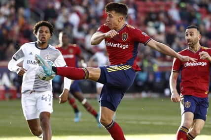 Apr 9, 2022; Sandy, Utah, USA; Real Salt Lake forward Tate Schmitt (21) shoots against Toronto FC midfielder Kosi Thompson (47) in the first half at Rio Tinto Stadium. Mandatory Credit: Jeffrey Swinger-USA TODAY Sports
