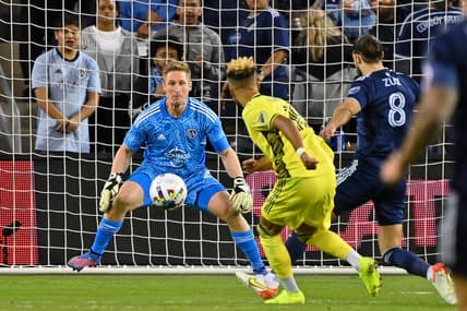 Apr 9, 2022; Kansas City, Kansas, USA; Nashville SC midfielder Hany Mukhtar (10) shoots the ball against Sporting Kansas City goalkeeper Tim Melia (29) during the second half at Children's Mercy Park. Mandatory Credit: Peter Aiken-USA TODAY Sports