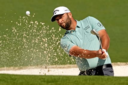 Apr 10, 2022; Augusta, Georgia, USA; Jon Rahm plays a shot from a bunker on the second hole during the final round of the Masters golf tournament. Mandatory Credit: Rob Schumacher-USA TODAY Sports