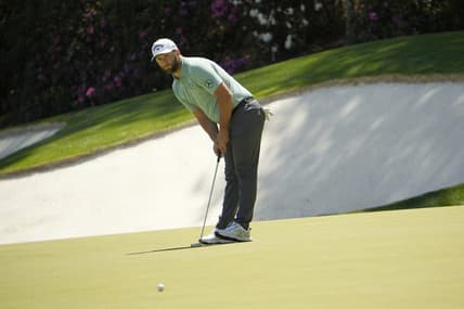 Apr 10, 2022; Augusta, Georgia, USA; Jon Rahm putts on no. 13 during the final round of the Masters Tournament at Augusta National Golf Club. Mandatory Credit: Adam Cairns-Augusta Chronicle/USA TODAY Sports