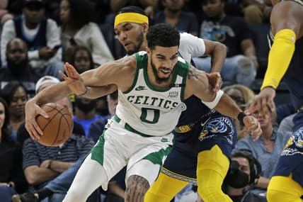 Apr 10, 2022; Memphis, Tennessee, USA; Boston Celtics forward Jayson Tatum (0) drives to the basket as Memphis Grizzlies forward Ziaire Williams (8) defends during the first half at FedExForum. Mandatory Credit: Petre Thomas-USA TODAY Sports