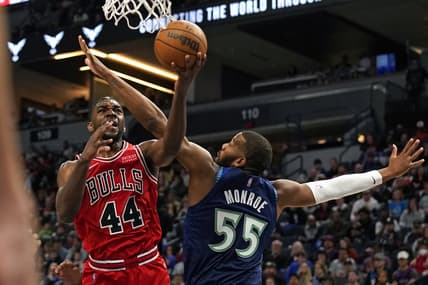 Apr 10, 2022; Minneapolis, Minnesota, USA;  Chicago Bulls forward Patrick Williams (44) shoots against Minnesota Timberwolves center Greg Monroe (55) during the third quarter at Target Center. Mandatory Credit: Nick Wosika-USA TODAY Sports