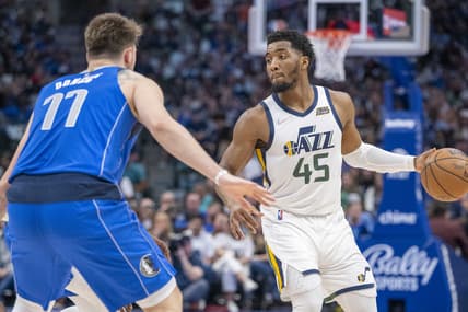 Mar 27, 2022; Dallas, Texas, USA; Dallas Mavericks guard Luka Doncic (77) guards Utah Jazz guard Donovan Mitchell (45) during the game at the American Airlines Center. Mandatory Credit: Jerome Miron-USA TODAY Sports
