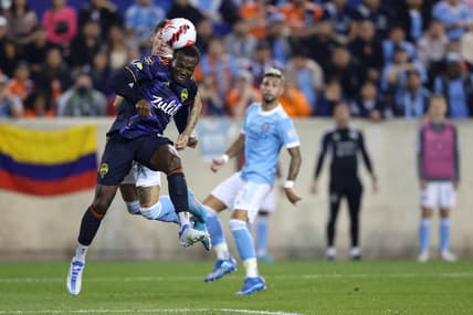 Apr 13, 2022; Harrison, NJ, USA; Seattle Sounders defender Nouhou Tolo (5) heads the ball away during the second half against the New York City FC at Red Bull Arena. Mandatory Credit: Vincent Carchietta-USA TODAY Sports
