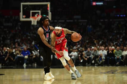 Apr 15, 2022; Los Angeles, California, USA; New Orleans Pelicans forward Brandon Ingram (14) moves the ball against Los Angeles Clippers guard Terance Mann (14) during the first half of the play in game at Crypto.com Arena. Mandatory Credit: Gary A. Vasquez-USA TODAY Sports