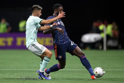Apr 16, 2022; Atlanta, Georgia, USA; Atlanta United midfielder Thiago Almada (8) defends against FC Cincinnati defender Tyler Blackett (24) in the first half at Mercedes-Benz Stadium. Mandatory Credit: Brett Davis-USA TODAY Sports