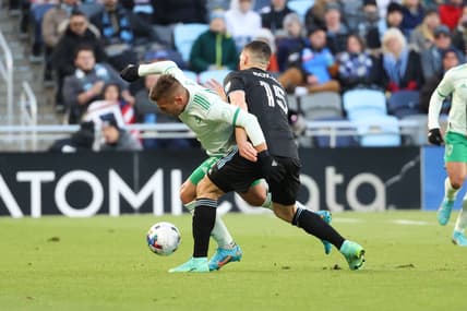 Apr 16, 2022; Saint Paul, Minnesota, USA; Minnesota United defender Michael Boxall (15) and Colorado Rapids forward Diego Rubio (11) battle for the ball during the first half at Allianz Field. Mandatory Credit: Matt Krohn-USA TODAY Sports