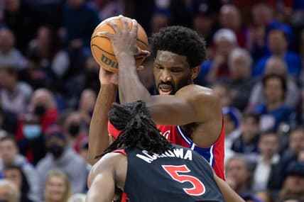 Apr 18, 2022; Philadelphia, Pennsylvania, USA; Philadelphia 76ers center Joel Embiid (21) controls the ball against Toronto Raptors forward Precious Achiuwa (5) during the third quarter in game two of the first round for the 2022 NBA playoffs at Wells Fargo Center. Mandatory Credit: Bill Streicher-USA TODAY Sports