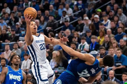 Apr 21, 2022; Minneapolis, Minnesota, USA; Memphis Grizzlies guard Desmond Bane (22) shoots against the Minnesota Timberwolves center Karl-Anthony Towns (32) in the first quarter during game one of the three round for the 2022 NBA playoffs at Target Center. Mandatory Credit: Brad Rempel-USA TODAY Sports