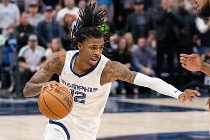 Apr 21, 2022; Minneapolis, Minnesota, USA; Memphis Grizzlies guard Ja Morant (12) dribbles against the Minnesota Timberwolves in the second quarter during game one of the three round for the 2022 NBA playoffs at Target Center. Mandatory Credit: Brad Rempel-USA TODAY Sports