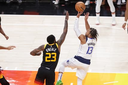 Apr 21, 2022; Salt Lake City, Utah, USA; Dallas Mavericks guard Jalen Brunson (13) shoots the ball over Utah Jazz forward Royce O'Neale (23) during the first quarter at Vivint Arena. Mandatory Credit: Chris Nicoll-USA TODAY Sports