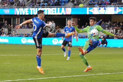 Apr 23, 2022; San Jose, California, USA; San Jose Earthquakes forward Cristian Espinoza (10) scores a goal against Seattle Sounders defender Xavier Arreaga (3) during the first half at PayPal Park. Mandatory Credit: Darren Yamashita-USA TODAY Sports