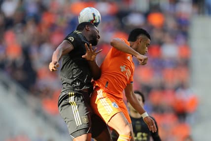 Apr 24, 2022; Cincinnati, Ohio, USA; Los Angeles FC defender Doneil Henry (44) heads the ball out of reach of FC Cincinnati forward Brenner (9) in the first half at TQL Stadium. Mandatory Credit: Katie Stratman-USA TODAY Sports