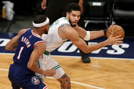Apr 25, 2022; Brooklyn, New York, USA; Boston Celtics forward Jayson Tatum (0) controls the ball against Brooklyn Nets forward Bruce Brown (1) during the first quarter of game four of the first round of the 2022 NBA playoffs at Barclays Center. Mandatory Credit: Brad Penner-USA TODAY Sports