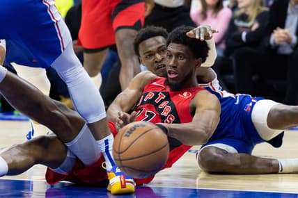 Apr 25, 2022; Philadelphia, Pennsylvania, USA; Toronto Raptors forward Thaddeus Young (21) passes the ball from the floor past Philadelphia 76ers forward Paul Reed (44) during the second quarter in game five of the first round for the 2022 NBA playoffs at Wells Fargo Center. Mandatory Credit: Bill Streicher-USA TODAY Sports